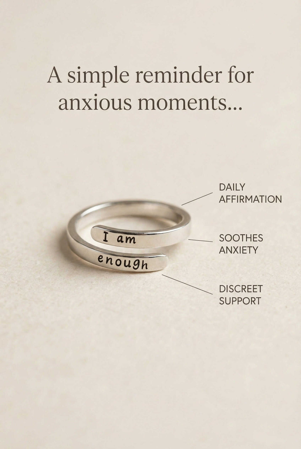 Silver ring with 'I am enough' engraving on a beige background